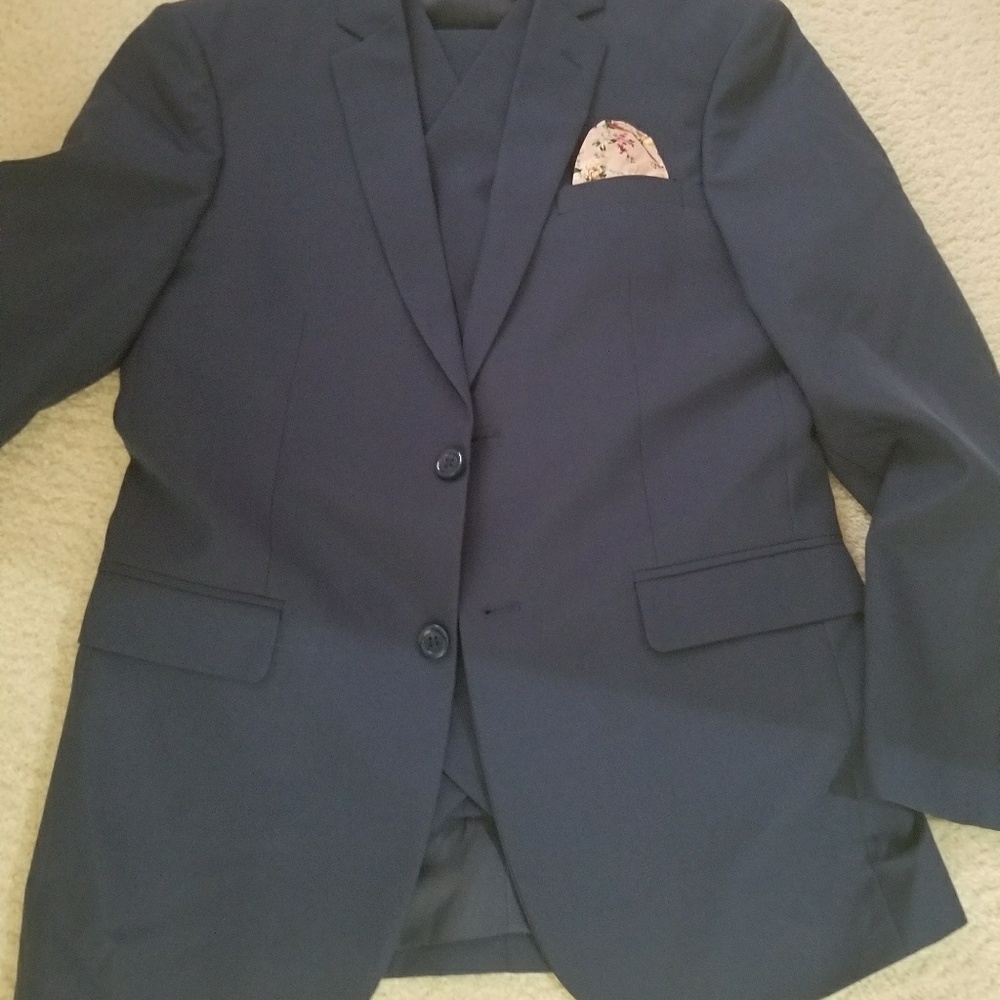 Three piece suit with pocket square